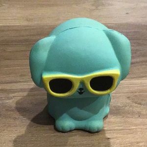 A squishy as a blue dog With sunglasses